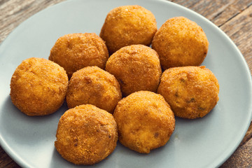 Arancini sicilian street food - rice balls stuffed with meat cooked