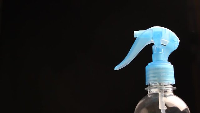 Using spraying bottle and cleaning 