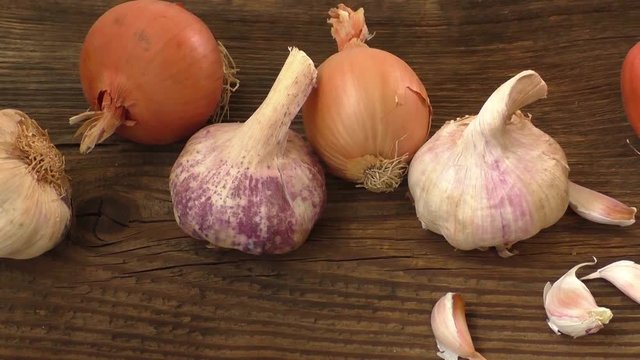 Garlic and onion on cutting board
