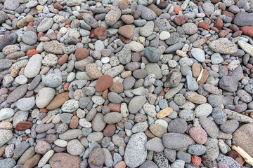 Texture of sea pebbles in the beach