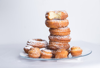 homemade donuts with powdered sugar