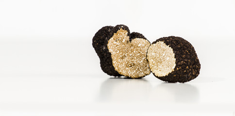 Truffle with plane and glass, white background