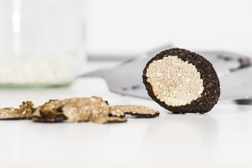 Truffle with plane and glass, white background