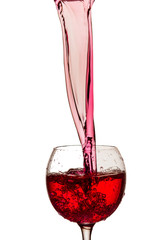 Red wine splash over white background drink