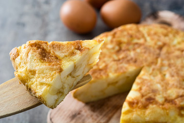 Traditional spanish omelette on wooden table


