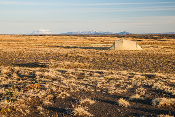camping in the wild highland landscape in iceland at evening