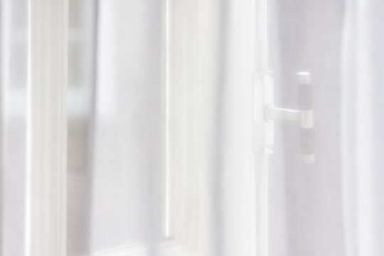 Window behind curtain