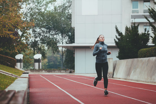Young woman jogging on a cold day