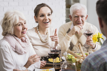 Family members drinking wine