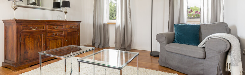Room with wooden chest of drawers