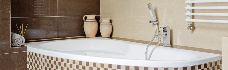 Bathroom with brown and beige tiles