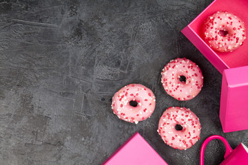 Tasty donuts on dark background