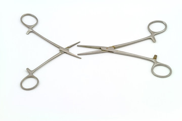 Surgical instrument (hemostat or artery clamp ) on white background 
