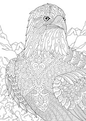 Stylized eagle (hawk, falcon, osprey) among prairie mountains. Freehand sketch for adult anti stress coloring book page with doodle and zentangle elements.