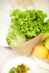 paper bag with lettuce and cabbage, close-up