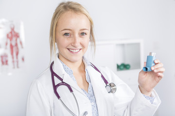 Medical doctor at work with inhaler