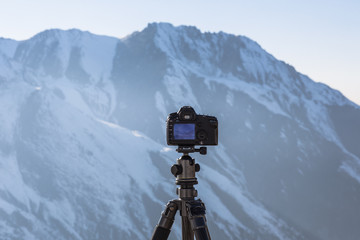 the camera photographs the mountain