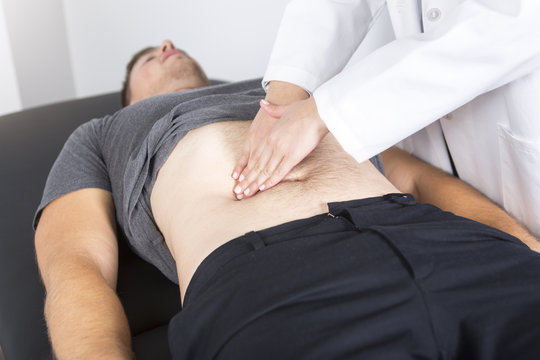 Doctor examining her patient in medical office