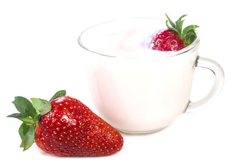 one large red ripe strawberries near the cup with strawberry yog