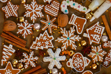 christmas gingerbread cookies with christmas decorations on wood - christmas food background