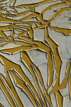 Falling paint on a metal surface