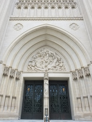 The portal of the Cathedral Church of Saint Peter and Saint Paul in the City and Diocese of Washington DC, known as The National Cathedral, with architectural and sculptural neo Gothic details. - obrazy, fototapety, plakaty