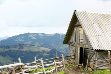 Fototapeta na wymiar Old single house in mountains