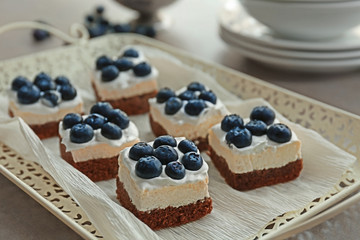 Delicious blueberry cakes on tray