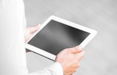 Lawyer  holding tablet on the street