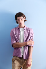Handsome young man on blue background