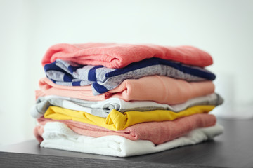Pile of clothes on gray table, closeup