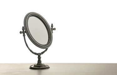 Female mirror on light background