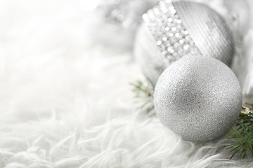 Fototapeta na wymiar Close up view of beautiful Christmas bauble on white fur