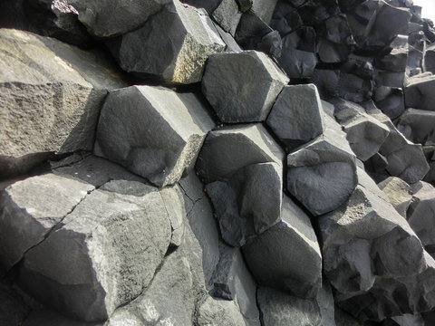 Hexagonal basalt columns geological rock formation in Iceland