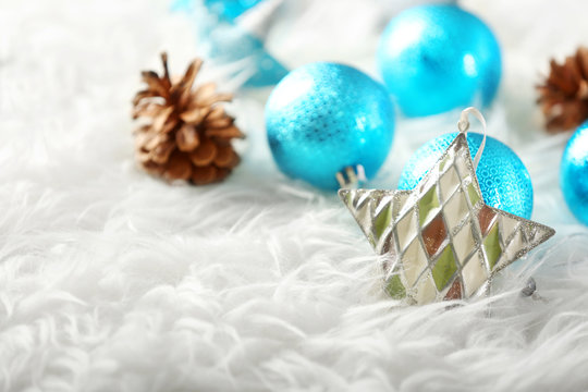 Beautiful Christmas decor on white fur, close up