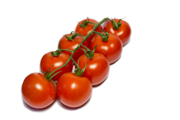 cherry tomatoes on a white surface