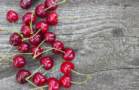 Ripe cherry on a wooden  background 