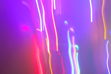 Chaotic lights in moriol blur out of focus - abstract photograph background.