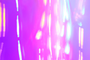 Chaotic lights in moriol blur out of focus - abstract photograph background.