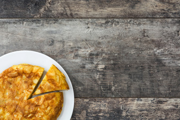 Traditional spanish omelette on wooden table

