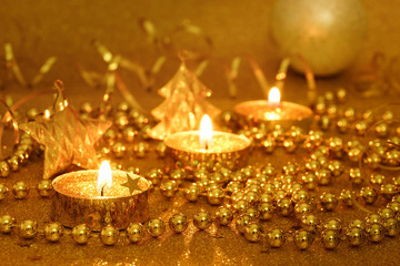 New Year composition with candles in golden shades