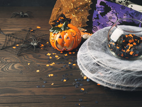Halloween background with spider net and confetti