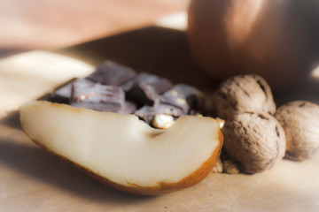 Fototapeta na wymiar Pears, chocolate and nuts