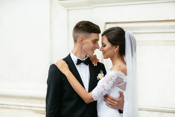 Portrait of the beautifull bride and groom. Newlyweds enjoying romantic moments at their wedding.