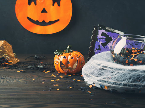 Halloween background with spider net and pumpkin
