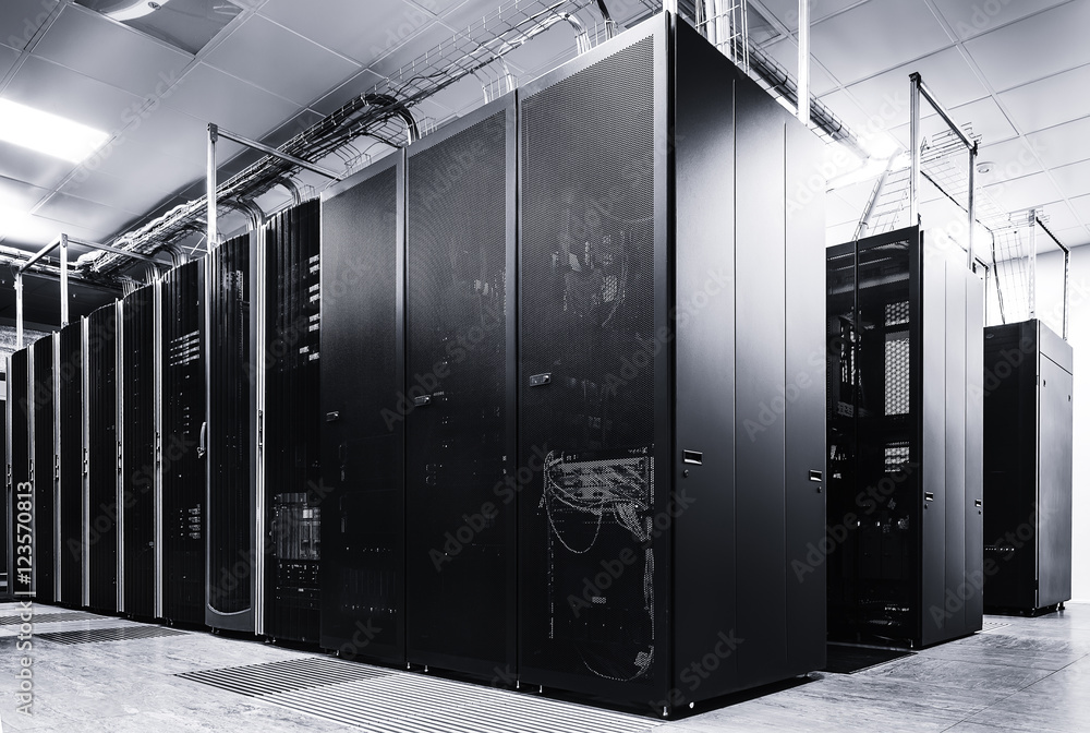 Poster room with rows of server hardware in data center black and white