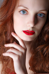Fototapeta premium Portrait of beautiful redhead girl close up