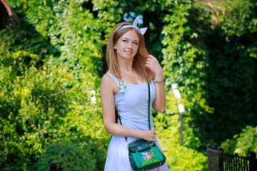 Portrait of a beautiful young girl in the Park skirt