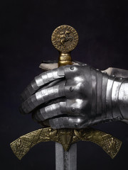 The sword of the Crusader and the knight's glove.