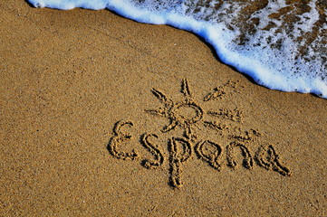 Spain sign on the sand beach
